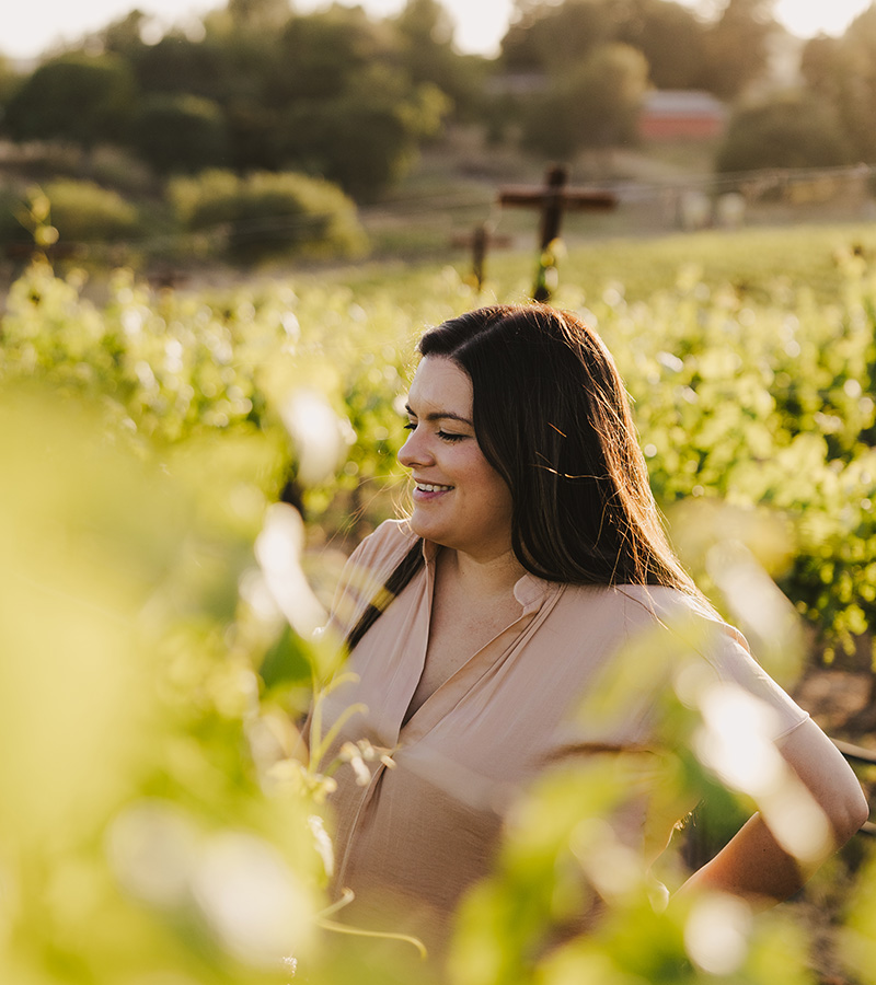 Samantha Mogull amongst the vines